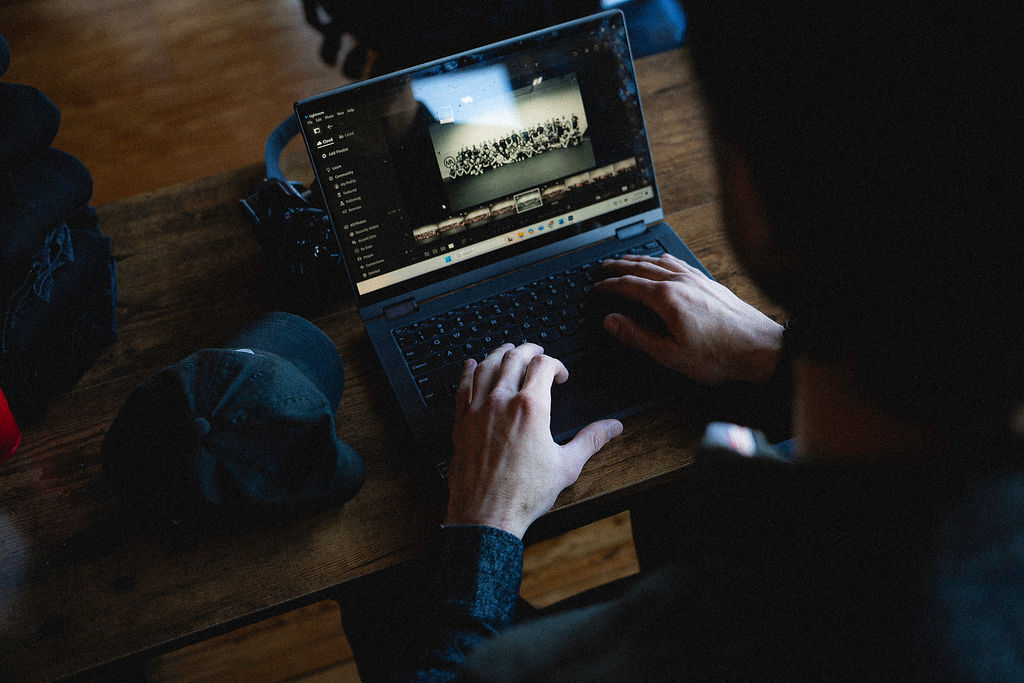 PDMA Digital Marketing | Web and Brand Development | Owner editing photos in Adobe Lightroom