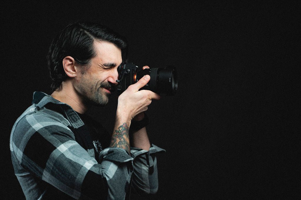 PDMA Digital Marketing | Photography and Videography| Owner of PDMA Digital Marketing taking a photo